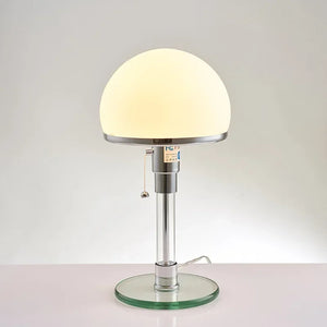 Lumière glasbordslampa tänd med varmt ljus
